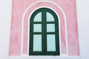 Classic wooden window on pink wall