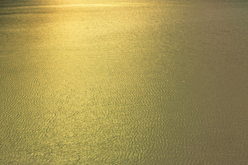 background sea water gold color at sunset