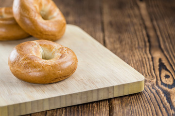 Bagels on a wooden table (close-up shot)