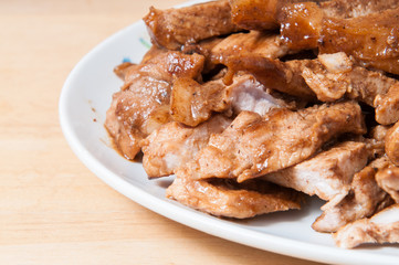 Pork slices in a dish on the table.