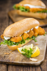 Roll with fried Fish Sticks (close-up shot)