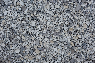 Nature background from gray sea pebbles