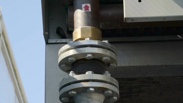 The siver steel screws on the pipes from the valves with the red arrow sign on the top