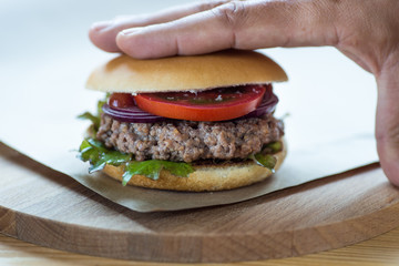 Home made hamburger on a kraft paper.