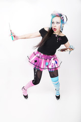 Schrille Junge Frau als bunte Krankenschwester im Gothic / Punk Look