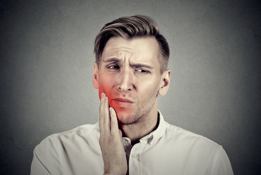 Man with sensitive toothache problem about to cry from pain