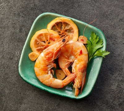 roasted prawns on green plate
