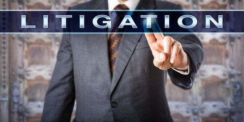 Male Attorney Pressing LITIGATION Onscreen
