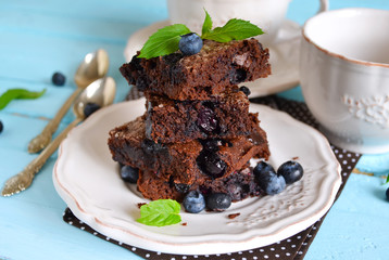 chocolate brownie with strawberries on a black background