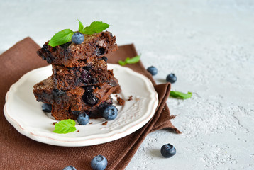 chocolate brownie with strawberries on a black background