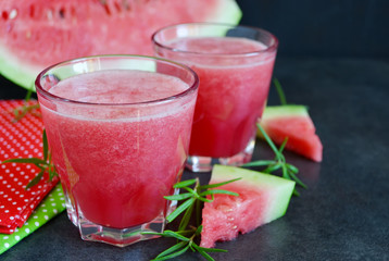 Summer cool drink,  juice of watermelon on a black background 