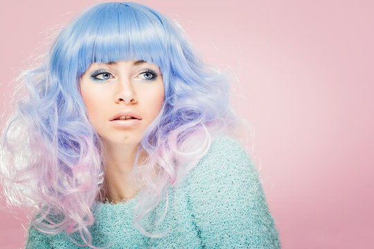 Gorgeous Young Woman With Pastel Blue And Pink Hair. Fashion Model With Colorful Hair