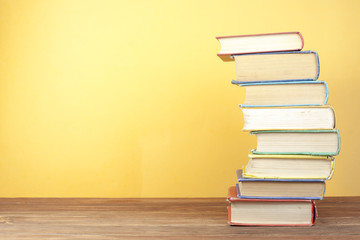 Stack of colorful books. Education background. Back to school. Copy space for text.