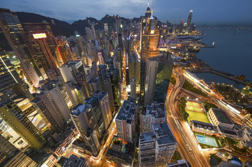 Naklejka premium office building at night in hong kong