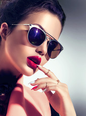 Sexy model girl wearing stylish sunglasses