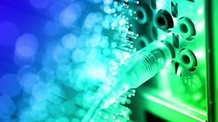 Connection of the audio wire to computer with Fiber optics background, shot in HD