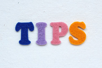 tips word on white handmade paper texture