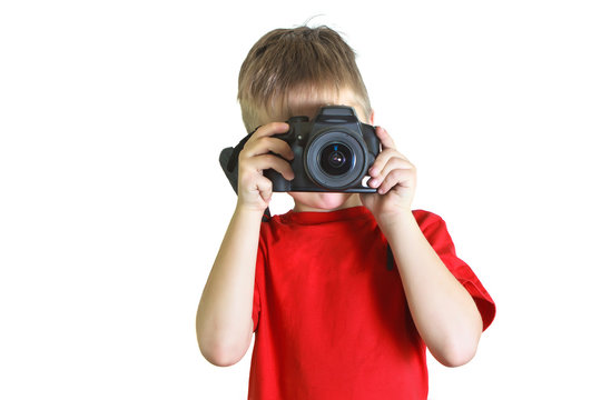 Boy taking pictures on a photocamera