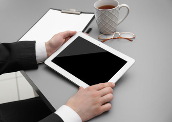 Businessman with tablet in office