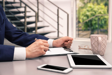 Businessman with tablet in office