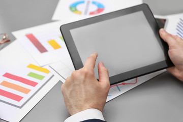 Businessman with tablet in office