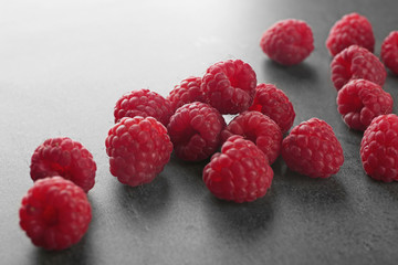 Fresh raspberry on grey table
