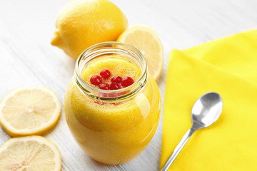 Fresh lemon cocktail on wooden background