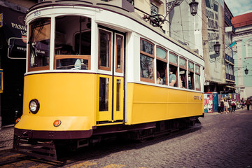 Naklejka na ściany i meble Lisboa,Portugal-April 12,2015: A traditional tram is making its
