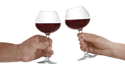 Hands with glasses of red wine, isolated on white