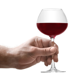 Hand with glass of red wine, isolated on white