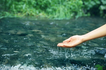 Woman pouring water in hand