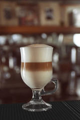 Latte on blurred bar background