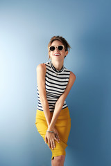 Fototapeta premium Beautiful girl on blue background