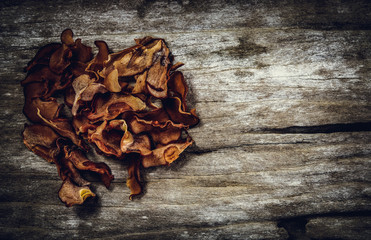 Garcinia cambogia fresh fruit on wood background.  Fruit for diet and good health.