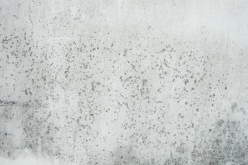 Surface of white walls are old, dirty, rough, black stains Filled with smudges of color decay. abstract background.