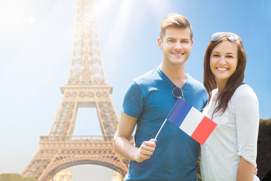 Happy Couple Holding French Flag