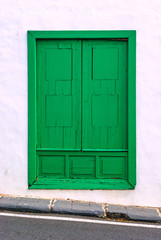 Green window of typical white house.  Lanzarote. Canary Islands. Spain