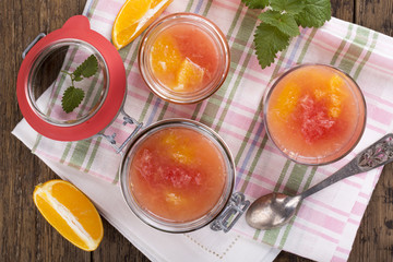 Citrus jelly in a glass jar.
