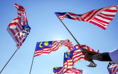 Malaysia flag also known as Jalur Gemilang wave with the blue sky.