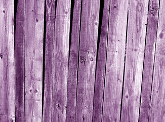 Grungy purple wooden fence texture.