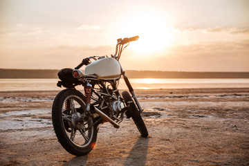 Retro motorcycle standing in the desert
