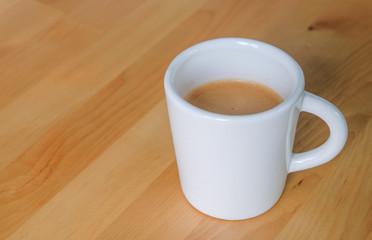 Coffee Cup on Wooden Table