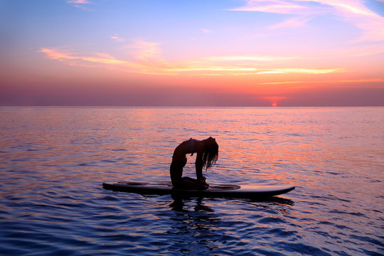 Woman trainings on the beach