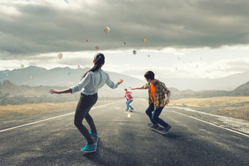 Teenagers ride skateboard . Mixed media