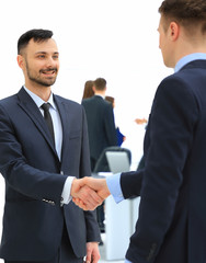 shaking hands in the office at the beginning of the working day
