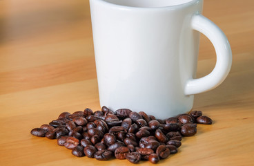 Coffee Cup and Beans on Wooden Table