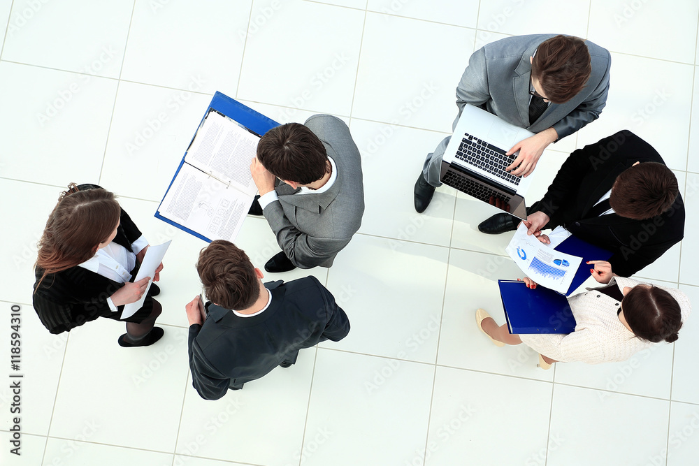 Wall mural Happy business people talking on meeting at office