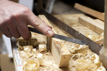 carpenter working,hammer,meter and screw-driver on construction
