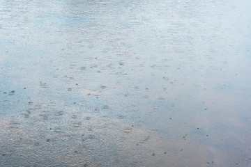 Rain on water surface.