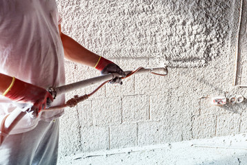 Plastering with a plastering pump - obrazy, fototapety, plakaty